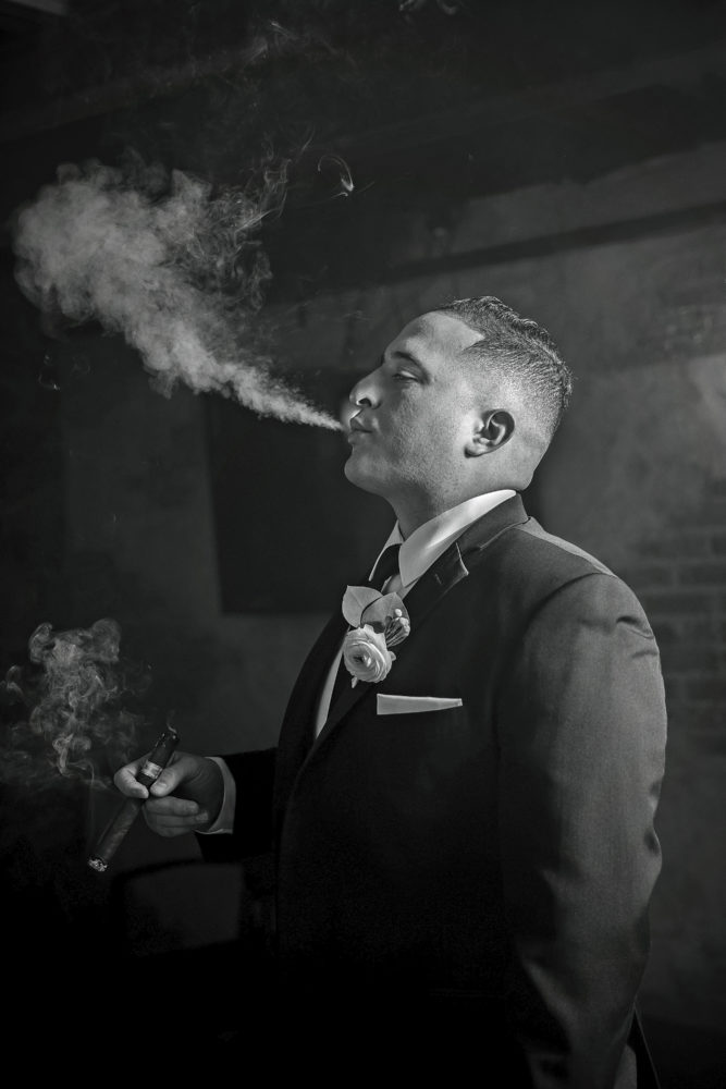 Groom smoking cigar